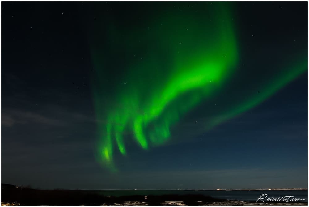 Die Nordlichter formen eine Hand